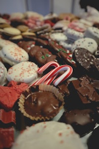 a table full of candy canes and cookies