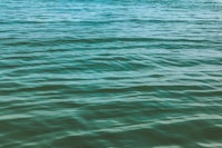 a man is riding a surfboard in the water