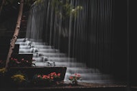 a black and white photo of a waterfall