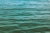 a man is riding a surfboard in the water