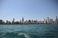 a city skyline seen from a body of water