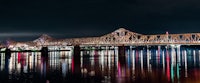 a bridge over a body of water at night