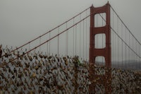 padlocks on a fence near the golden gate bridge in san francisco, california