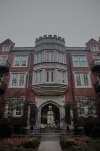 a red brick building with a large entrance